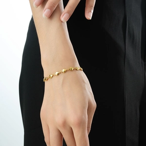 Elegant gold-tone heart chain bracelet for women featuring multi-heart linked design