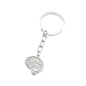 Anatomical brain shaped metal keychain with silver finish on a clean white background