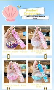 Close-up of four colorful shell-shaped keychains filled with pearls and star sequins