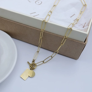 Gold paperclip chain necklace with square and round tags and T-bar toggle clasp