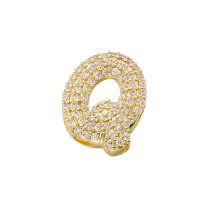 Macro shot of gold-plated letter Q pendant fully iced out with clear cubic zirconia stones