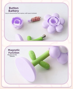Macro detail of purple flower night light showing magnetic base and button battery power