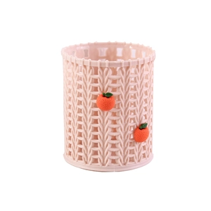Pink round desk pencil holder with orange motifs and textured woven surface design