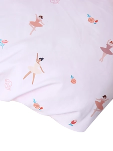 Detailed macro view of pink fabric with cartoon ballerina and floral patterns