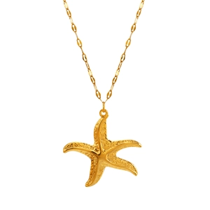 Elegant gold starfish pendant necklace with a textured finish for a beach vacation style