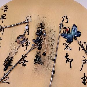 Three-piece silver hair stick set with tassels and butterfly motifs on calligraphy paper