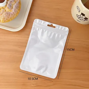 Close-up of 10.5x15cm white matte zip lock bag with hang hole on warm wood background