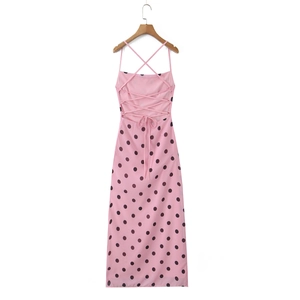 Detail of cross lace-up open back design on a pink polka dot midi dress