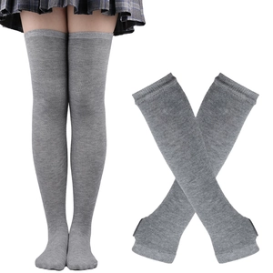Detailed view of grey over-knee knitted socks shown on model and flat layout