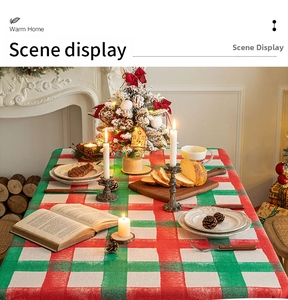 Detail of red and green plaid Christmas tablecloth in a cozy festive home setting