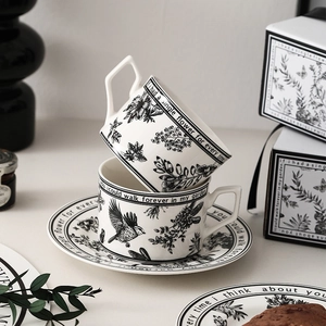 Vintage ceramic coffee cup and saucer set with floral bird prints in an elegant gift box