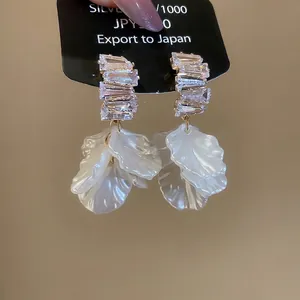 French vintage gold earrings with shell flower petals and long tassel fringe design