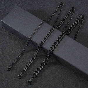Detailed view of three black Cuban chain bracelets in different widths with lobster clasps