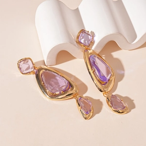 Vintage geometric gold earrings featuring tiered purple acrylic triangle pendants