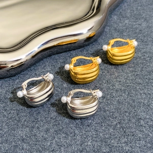 French luxury curved basket earrings in gold and silver with pearl accents