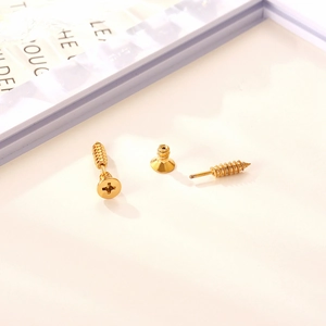 Gothic punk gold screw stud earrings for men and women featuring unique industrial design
