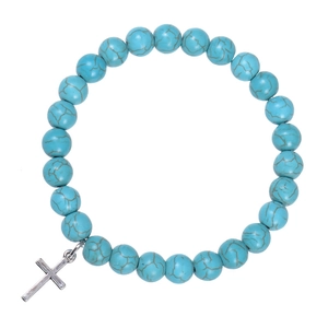 Detail view of turquoise beads with brown marble texture and silver cross pendant