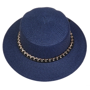 Detailed top view of navy blue straw hat with elegant black and gold chain trim