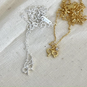 Elegant 925 sterling silver bowknot necklace with cubic zirconia in silver and gold