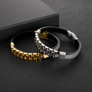 Macro view of leather bracelets with stainless steel watch buckle on black texture