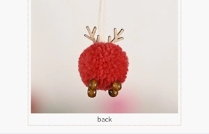 Back view of red felt reindeer ornament with wooden antlers and bead legs for Christmas