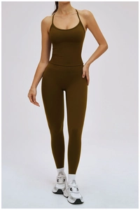 Detail of olive green high-stretch sports vest and high-waist yoga leggings on model