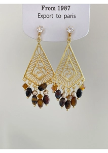 Detailed view of vintage gold hollow diamond earrings with hanging tiger eye beads