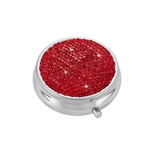 Portable silver metal pill box with red rhinestones in a 45-degree angle view