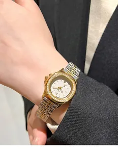 Close-up of luxury women's quartz watch with diamond-set square dial on female wrist