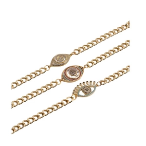 Golden Evil Eye bracelets with zircon charms in various designs on a white background
