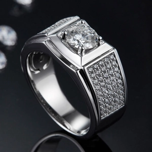 Men's 925 sterling silver moissanite ring with a round center stone on black background