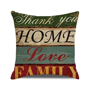 Detail of vintage wood grain pillow cover with Thank You and Home typography