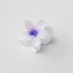 Detail of the 8cm white and purple gradient plumeria flower hair claw clip with a resin texture