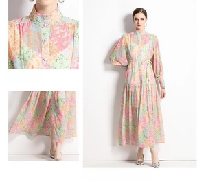 Detail of mandarin collar and layered ruffle hem on retro ethnic print maxi dress