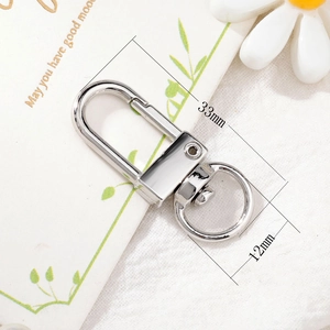 Detail view of silver alloy lobster clasp with 33mm length and rotating D-ring