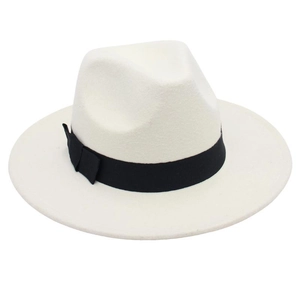 Detail view of white felt fedora hat featuring a classic black ribbon and soft texture