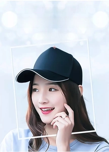 Close-up of black baseball cap with white brim piping on a model for custom design