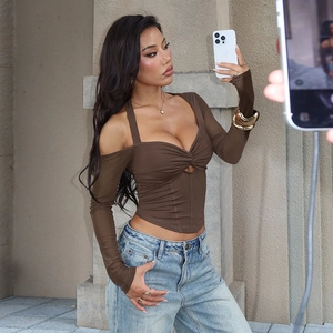 Close-up of brown long sleeve off-shoulder top with a twisted knot design and slim fit cut