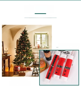 Detail of red Christmas refrigerator handle covers with Santa belt and button decorations