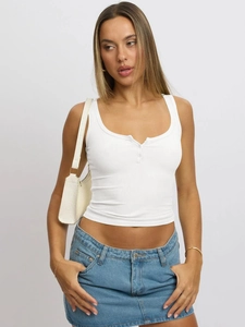 Close-up of white slim fit knit tank top with button U-neck detail and ribbed texture