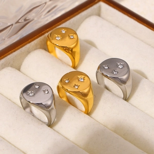 Set of four 18K gold and silver plated stainless steel rings with micro-set diamonds