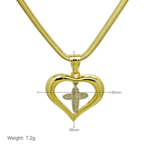 Detail of gold heart pendant with crystal cross and dimensions 30mm by 36mm