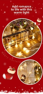 Detail of warm white LED string lights with metallic stars and frosted round balls