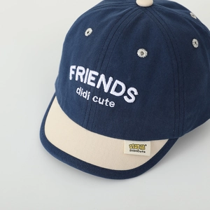 Close-up of FRIENDS embroidery and high-quality canvas texture on kids baseball cap