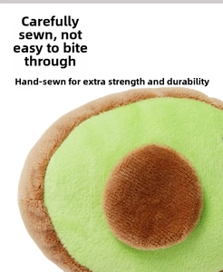 Detail of durable avocado plush dog toy with reinforced stitching and soft fabric