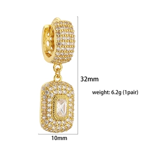Macro shot of gold square sugar earrings showing size 32mm by 10mm and 6.2g weight