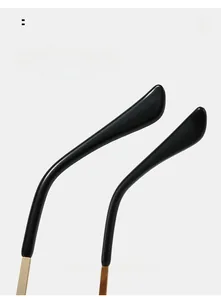 Detailed close-up of ergonomic black and gold curved metal temples for sunglasses