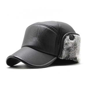 Detail of winter baseball cap with faux leather texture and thick faux fur earflaps