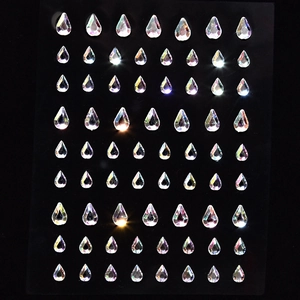 Macro shot of 56 teardrop AB crystal facial gems for makeup and nail art decoration