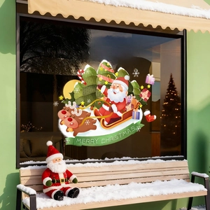 Christmas window decals with Santa and reindeer on glass for festive shop decoration